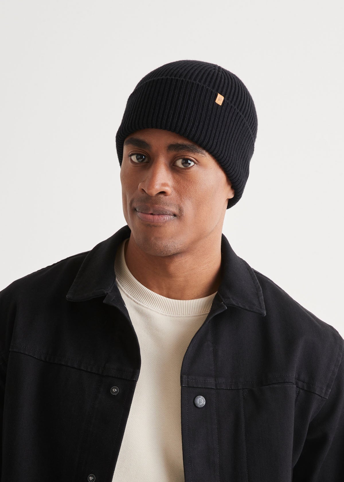 man wearing unisex warm merino black beanie front