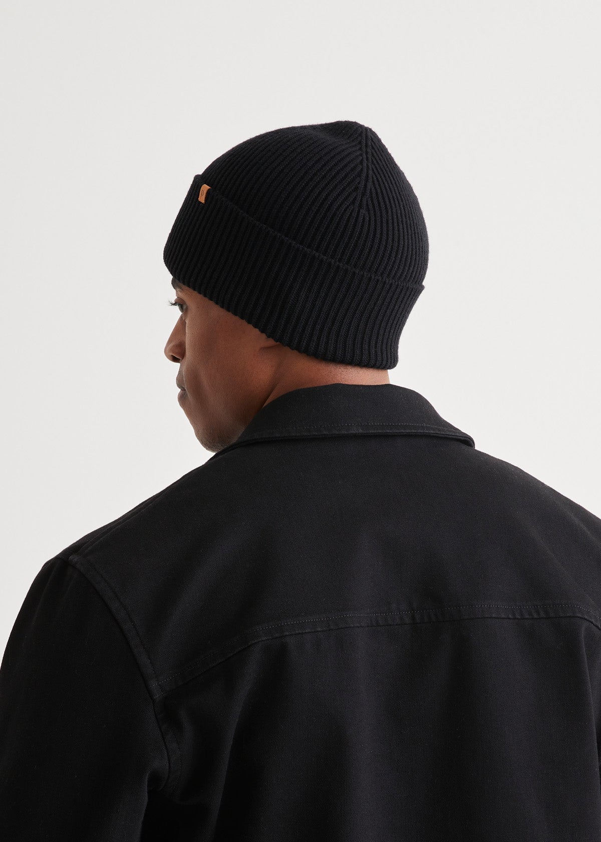 man wearing unisex warm merino black beanie back