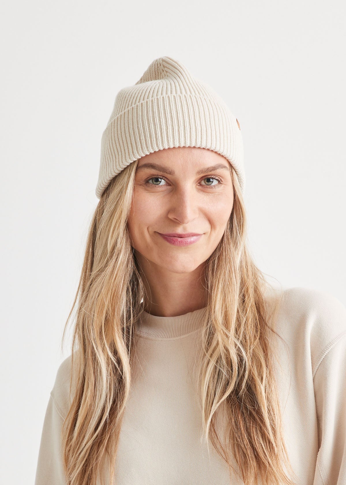 woman wearing unisex warm merino white beanie front