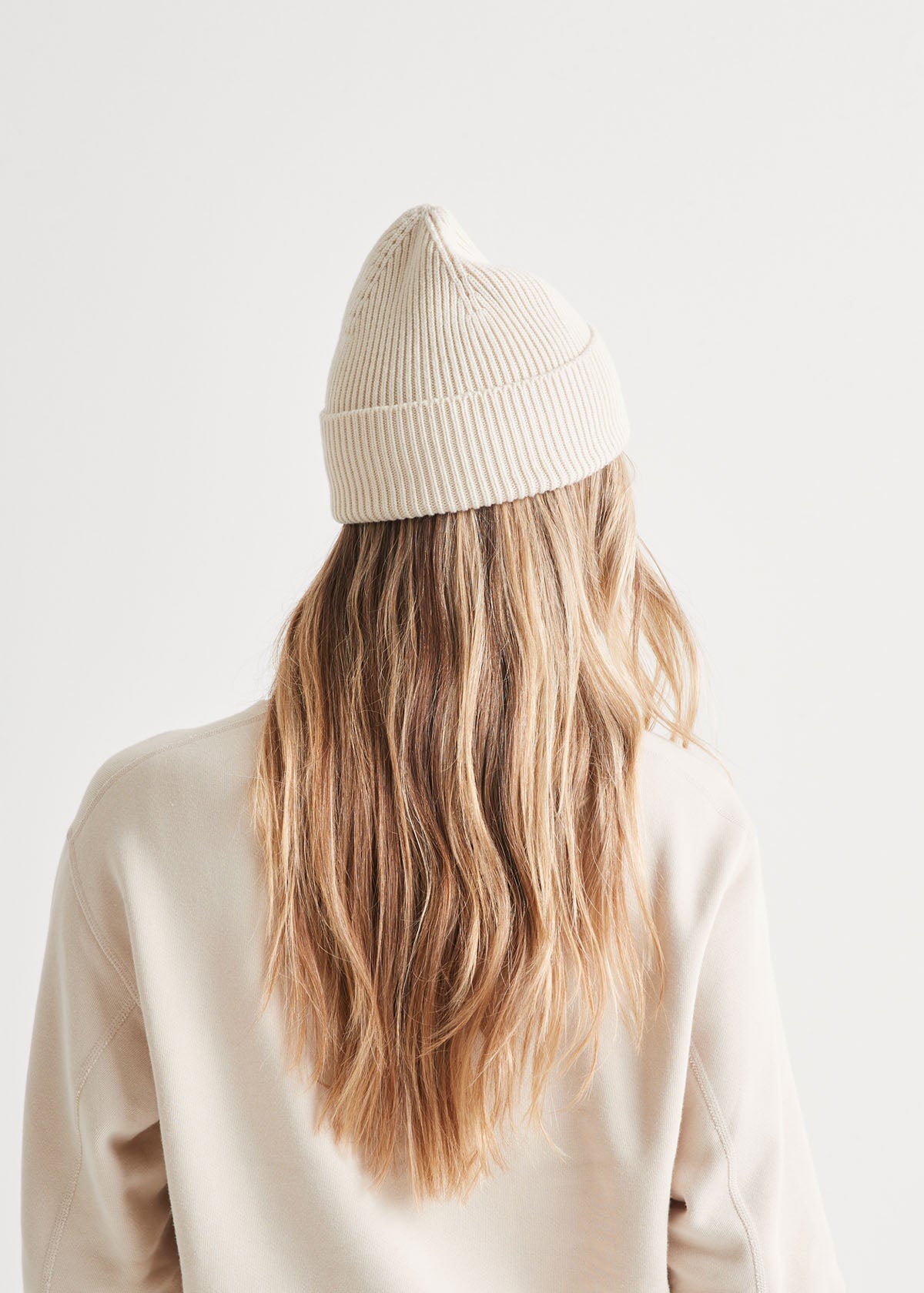 woman wearing unisex warm merino white beanie back