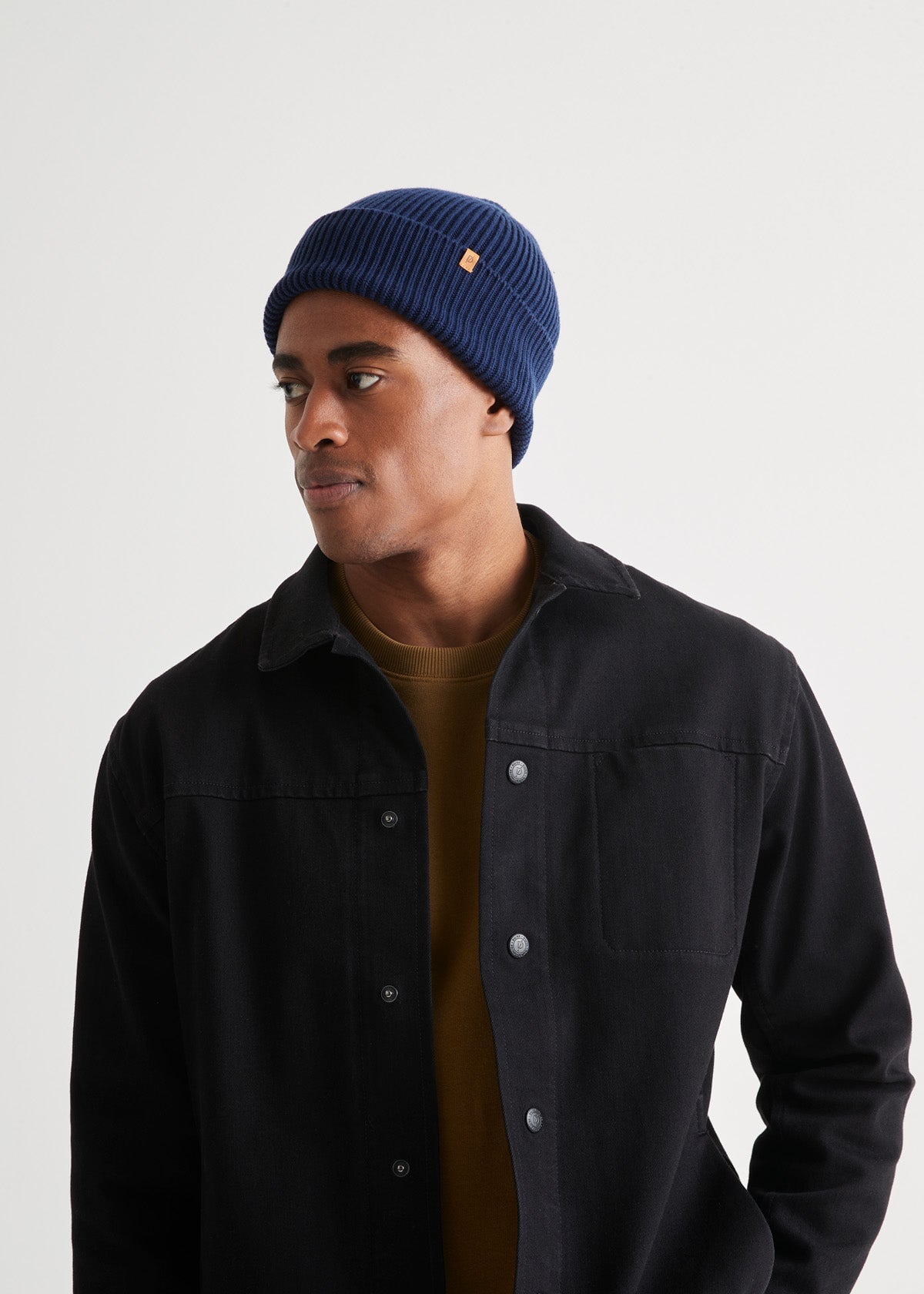 man wearing unisex warm merino navy beanie front