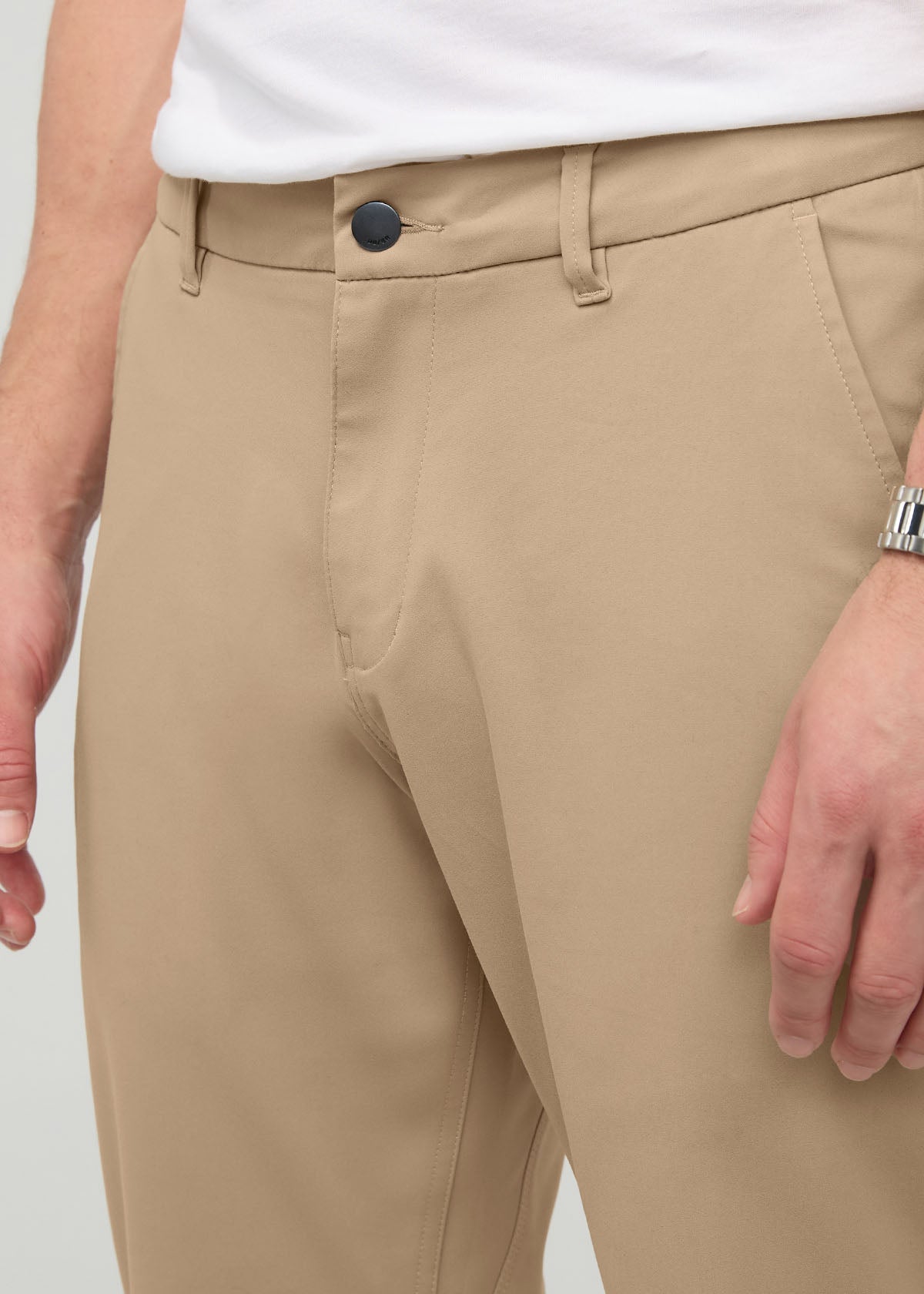 Desert khaki relaxed taper trousers with button waistband and tapered leg opening.