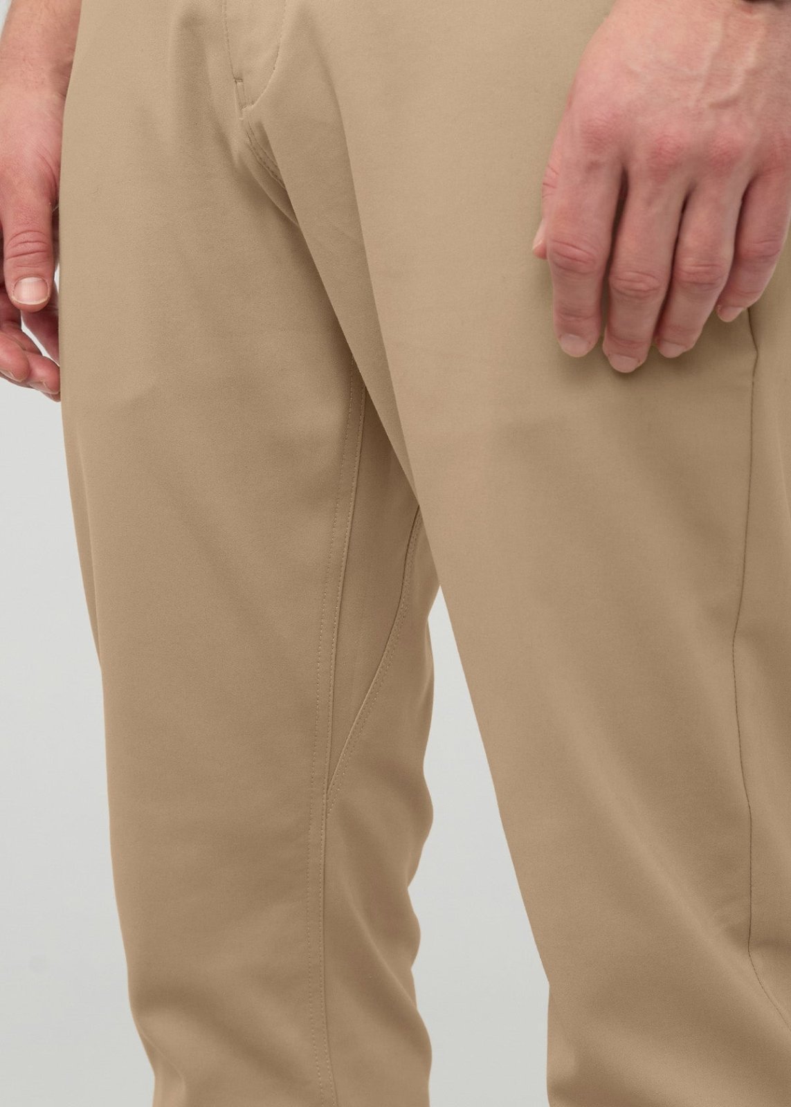 Desert khaki relaxed taper trousers with tapered leg opening and flat front seams.