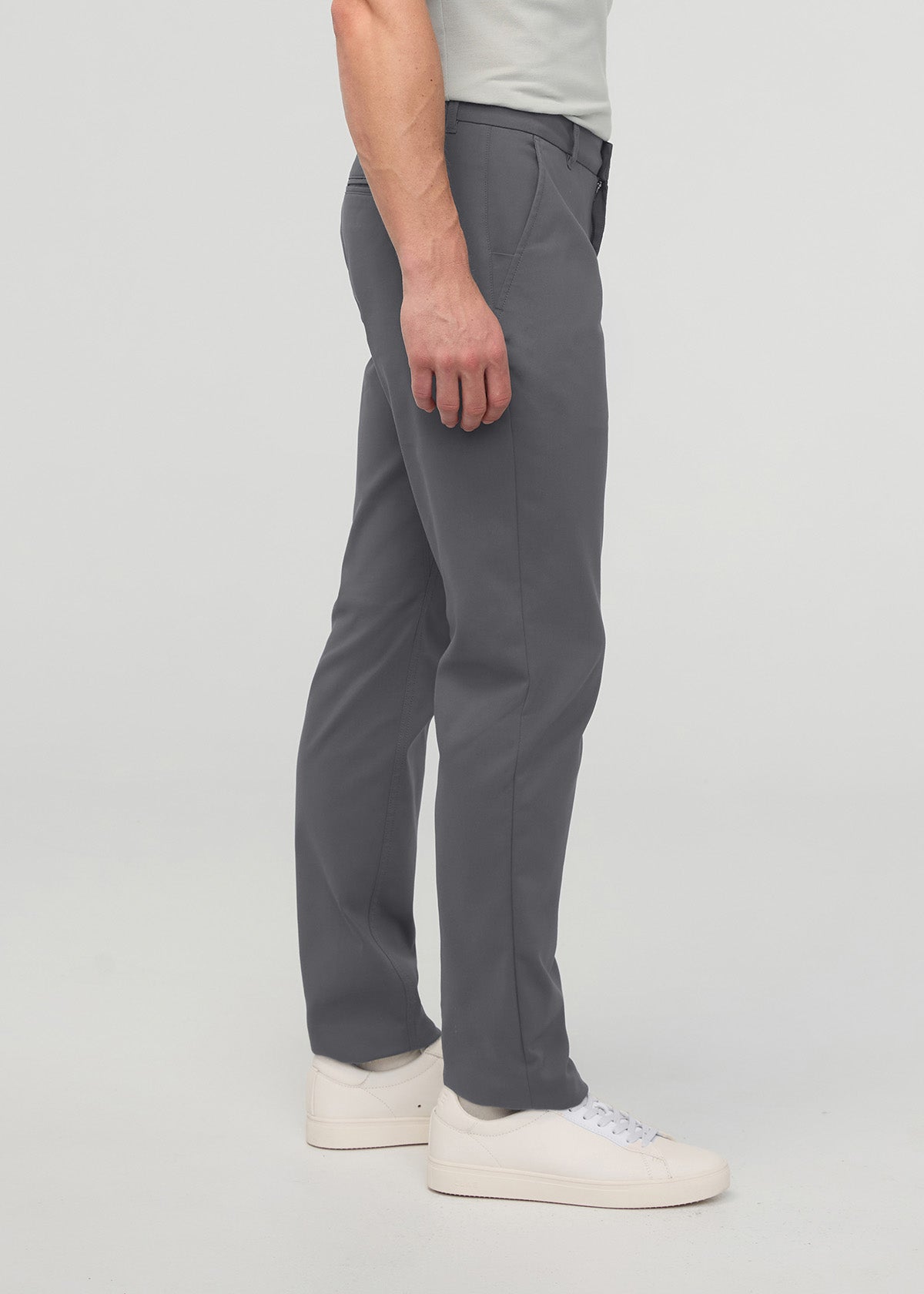 Gray relaxed taper trouser with tapered legs, shown on model wearing white sneakers.