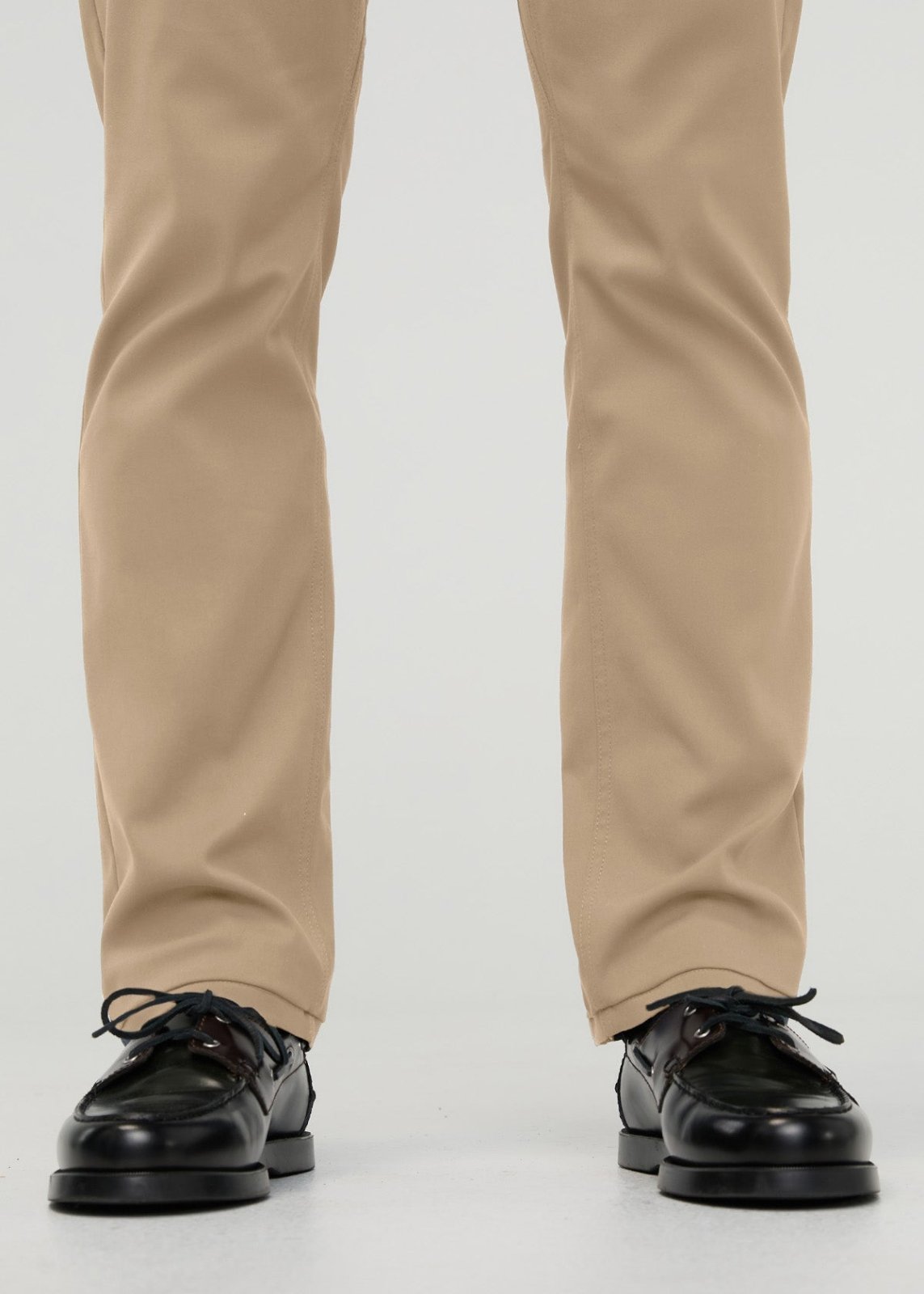Khaki straight-leg trousers with slim fit, shown from waist down with black lace-up shoes.