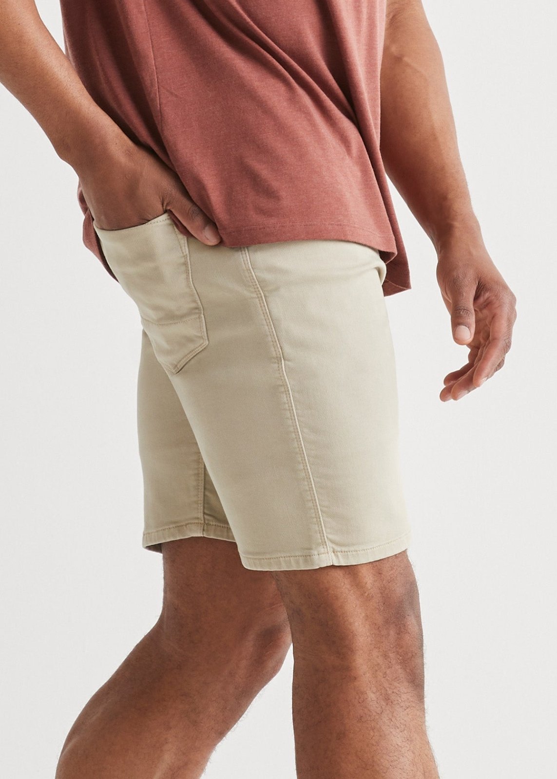 mens off-white slim fit performance short side with hand in back pocket