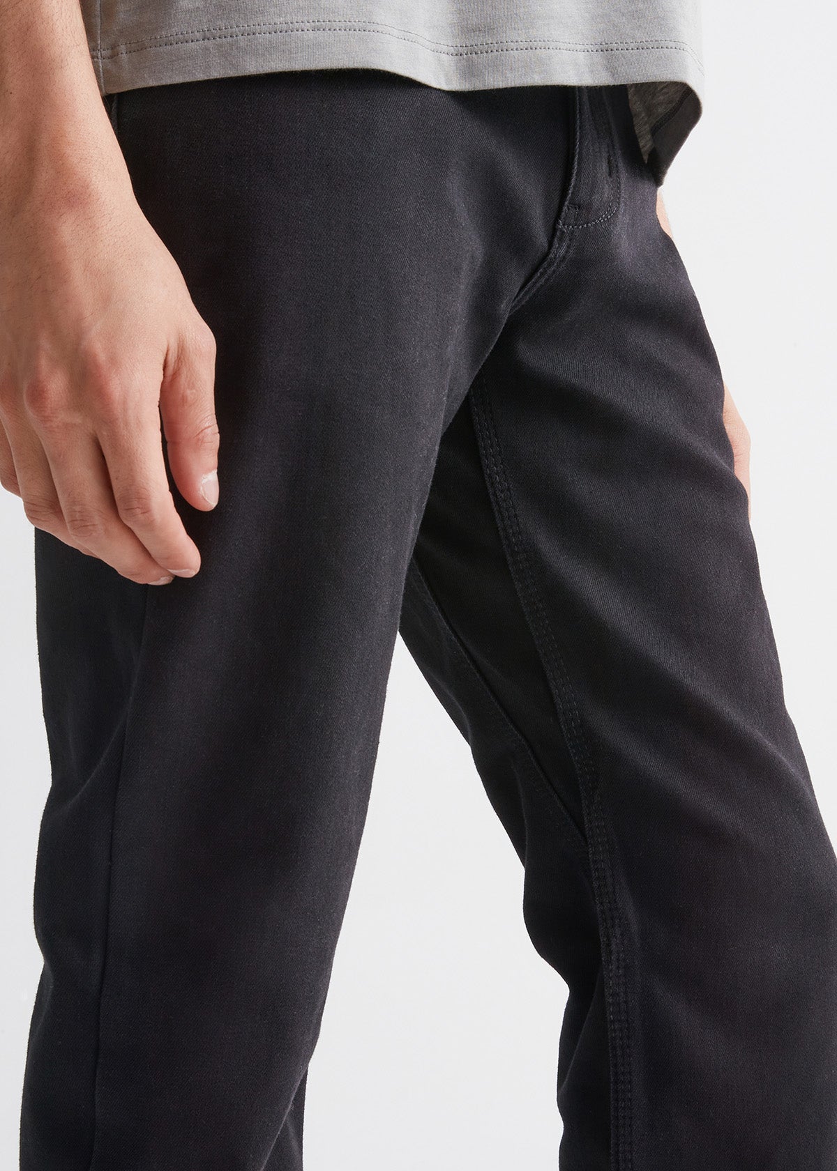 man wearing black slim fit waterproof stretch jeans gusset detail