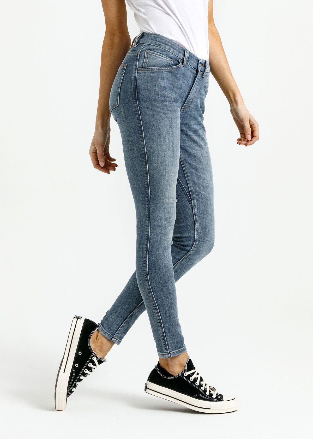 woman wearing light wash skinny fit stretch jeans side