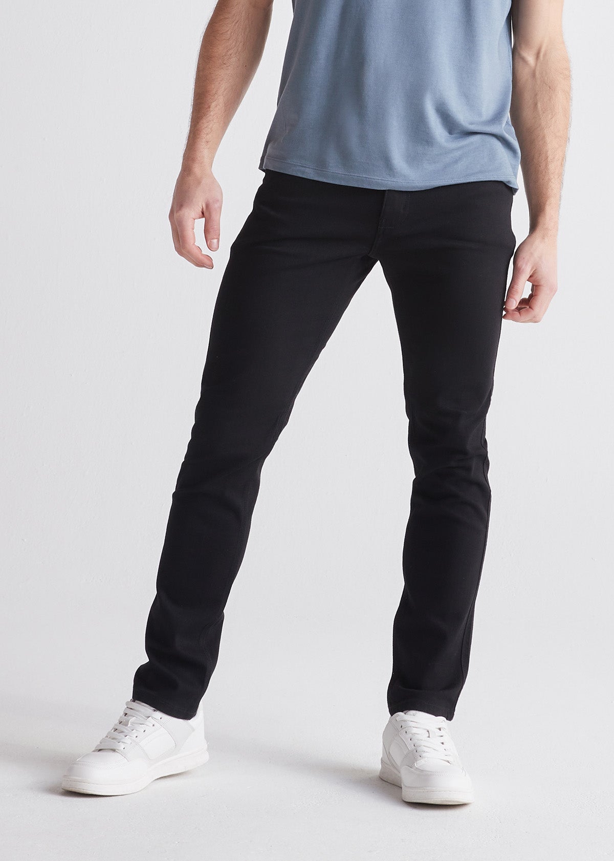 man wearing slim fit stretch jeans front